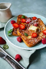 Homemade French toast with Brioche bread topped with berries