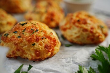 Homemade cheddar biscuits topped with garlic butter and parsley