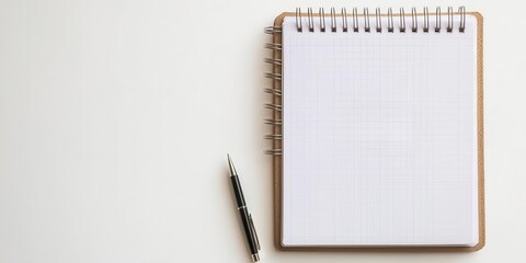 A blank notepad lies beside a pen, inviting creativity and ideas on a clean, minimalist workspace.