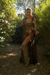 Fantasy female warrior cosplay in the woods