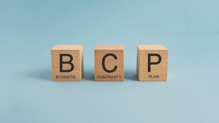 Wooden blocks spelling out  BCP  representing a business continuity plan a strategy for maintaining and recovering from potential disruptions or emergencies