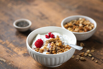 Granola yogurt bowl with raspberries