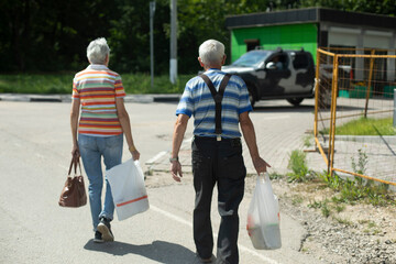 People on the street. People are walking along the road. City life.