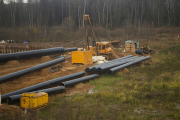Pipe laying. Gas pipes on the ground. Construction work.