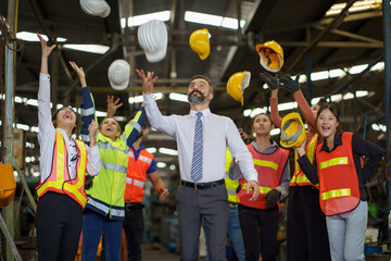 group of diversity engineer factory worker raise hands and  throw hard hat  celebrate job finished...