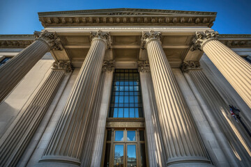 Fototapeta premium A majestic building features towering pillars and an impressive entrance, symbolizing justice and power