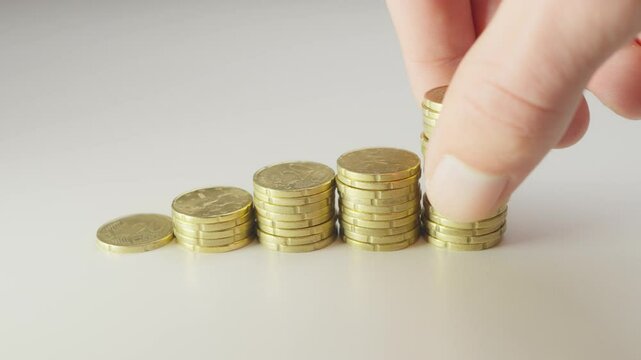 mage depicting stacks of gold coins symbolizing financial growth, savings, and investment. Ideal for concepts such as wealth, economy, and money management.