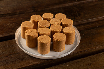 Sweet Brazilian Peanut Called Paçoca on a wooden desk