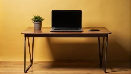 Minimalist Workspace with Laptop, Plant, and Phone on Wooden Desk