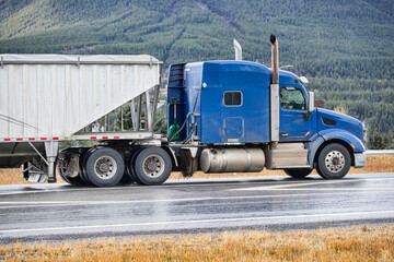 Heavy Cargo on the Road. A truck hauling freight along a highway. Taken in Alberta, Canada
