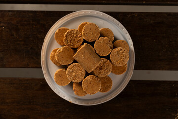 Sweet Brazilian Peanut Called Paçoca on a wooden desk