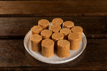 Sweet Brazilian Peanut Called Paçoca on a wooden desk