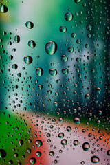 Forest view through a window on a rainy day, Rain drops on window.