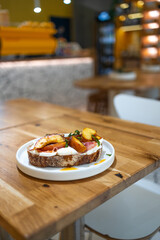 Breakfast sandwiches bread toast, bruschetta with grilled peaches and cheese. Healthy appetizer or snack. Food recipe background. High quality photo