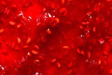 Background and texture of raspberry jam. Close-up.
