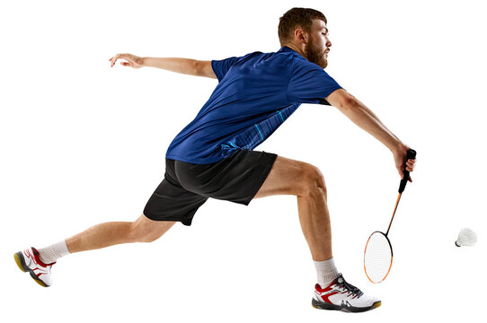 Badminton player lunges forward, perfectly timing his strike, against transparent background, shows intense concentration and athletic prowess. Concept of sport events, athleticism, focus. AD