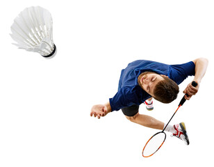 Determined badminton player reaches high for shuttlecock, his racket poised to strike against...