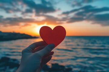 Fototapeta premium Romantic Sunset Love HeartShaped Paper Symbolizing Affection on Valentine's Day