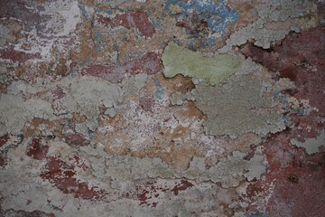peeling paint revealing layers of color and texture. Colorful peeling paint wall, old paint peeling texture, weathered pink red blue wall with peeling paint, revealing layers of history and character