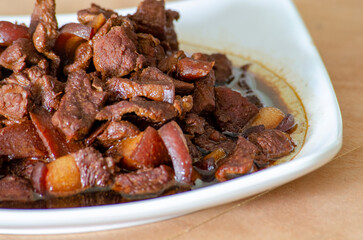 Close up view of delicious pork cooked in soy sauce. Asian food concept