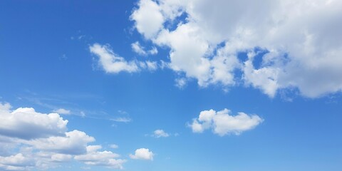 Obraz premium Serene blue sky with fluffy white clouds scattered across the horizon, nature, atmospheric