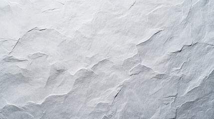 Textured surface of white stone with natural patterns, ideal for backgrounds or artistic projects.