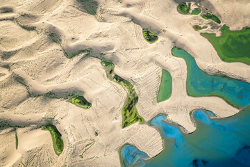 the sand with different color lakes