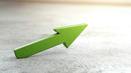 Green Arrow Pointing Upwards on a Soft Gray Background Symbolizing Growth, Progress, and Positive Direction in Business and Finance Environments