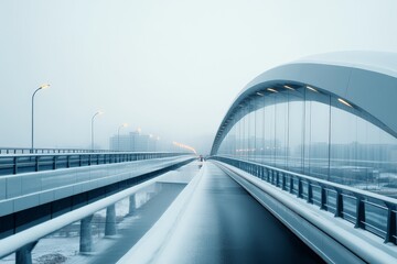 Obraz premium A snowy empty bridge underpass spanning across a calm cityscape on a serene winter morning, capturing the stillness and tranquility of winter in an urban setting.