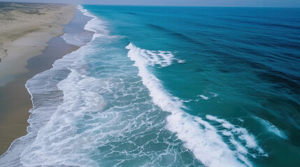 Breaking waves create geometric patterns on sandy beach aerial shot of pristine ocean minimalist nature photography