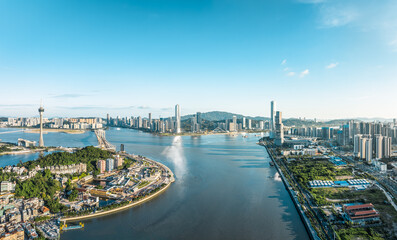 Fototapeta premium Modern city buildings with skyline and natural scenery in Macau