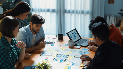 Top view of professional business team brainstorming and sharing idea by using mind map. Diverse people planning marketing strategy or designing Ux Ui design for mobile phone at meeting. Convocation.