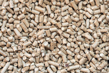 Wood pellets closeup for cat litter, background texture