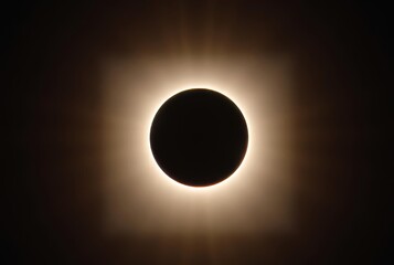 Solar Eclipse Dramatic rays peeking around the edges of the moon