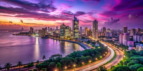 Fototapeta premium Nighttime City Skyline of Mumbai from Marine Drive with Illuminated Skyscrapers and Saifee Hospital against a Violet Magenta Sky Over the Back Bay Coast in Timelapse View