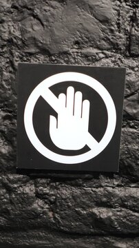 No Entry Sign on a Black Wall Background, emphasizing restrictions and warnings
