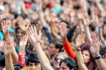 Fototapeta premium A large group of people celebrating and having fun, arms raised in excitement