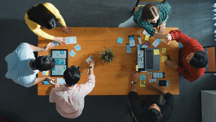 Programmer team brainstorm and plan Ux Ui design for mobile phone while present idea by using...