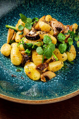 gnocci with mushrooms in plate