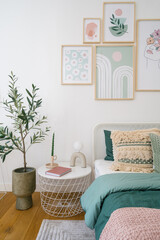 Stylish bedroom featuring modern decor and vibrant plant arrangements