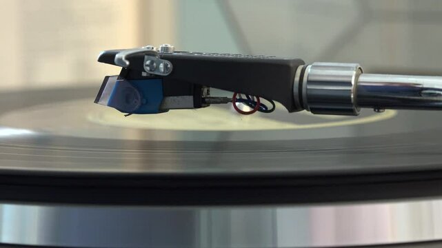 Close-up of the turntable needle engaging the vinyl record, with various arm movements. Captures the essence of vintage and analog music playback, evoking nostalgia and timelessness.