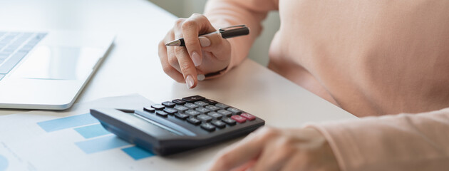 Deduction planning, debt asian young woman  hand using calculator to calculating money balance from...