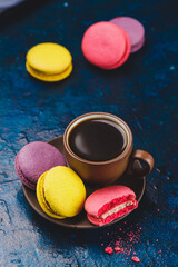 A cup of espresso coffee with macaroni cookies