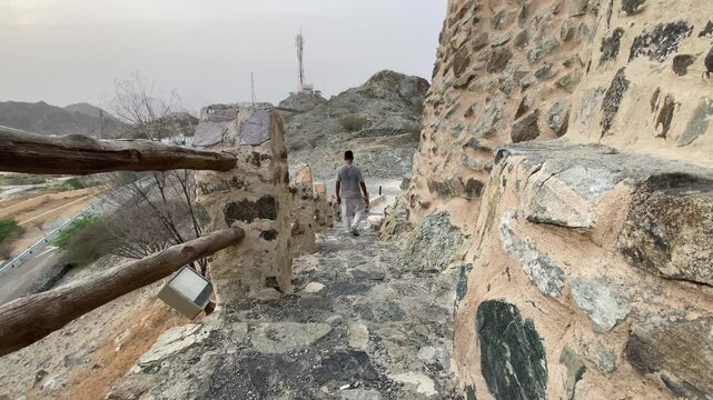 A young Man Anjoy Fort of Hatta heritage village tourist spot scenery in Hatta town