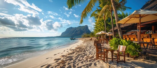 Naklejka premium Beachfront Cafe with Palm Trees and Mountains