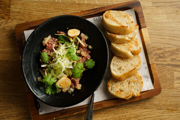 Gourmet beef tartare with toast slices