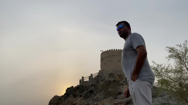 A young Man Enjoy Fort of Hatta heritage village tourist spot scenery in Hatta town