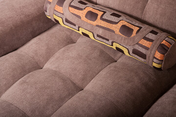 Detail of upholstery of upholstered furniture. Example of design of upholstered bed upholstery

