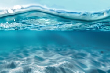 A serene underwater scene displaying clear blue water, gentle waves, and soft sandy bottom, perfect for nature and relaxation themes.