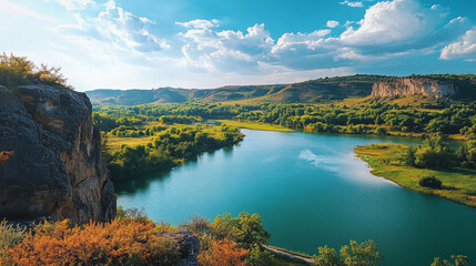 A wide river winds through a valley with green hills and trees